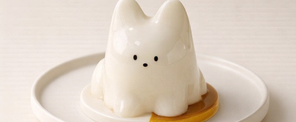 Cute cat-shaped ceramic ornament on plate
