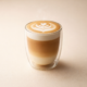 Latte art in clear double-walled glass.