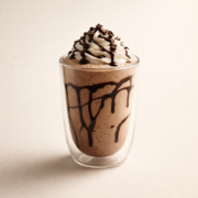 Chocolate beverage with whipped cream and drizzle