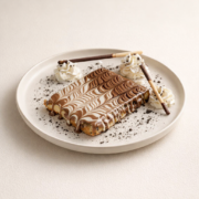 Chocolate swirled dessert with cream and sticks